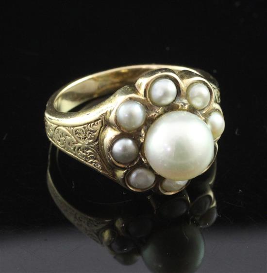 An early 20th century gold and split pearl cluster ring, size O.